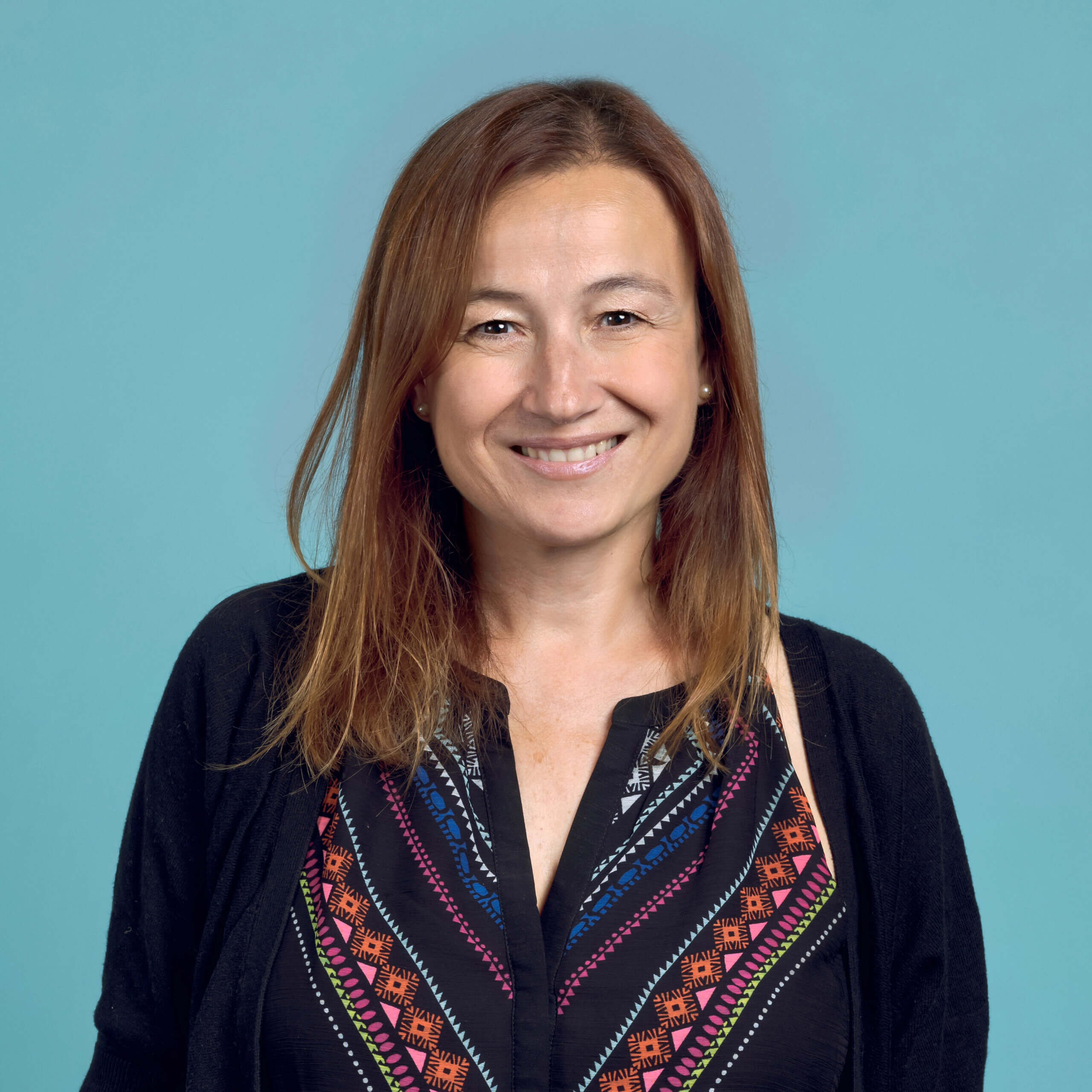 A profile photograph of Helena Duch, Head of the Solutions sub-programme which is part of the Prevent Child Sexual Abuse Programme at Oak Foundation.